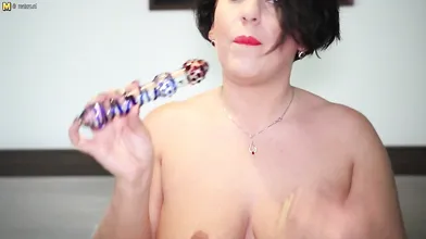 Sexy mom sticks her toy deep into her wet pussy