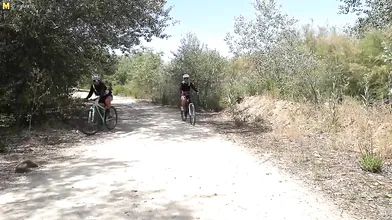 Two hot big breasted MILFs ssuck and fuck a younger biker in the open air