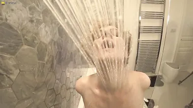 Steamy MILF with big tits playing in the bathroom