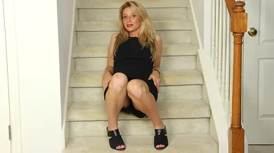 Naughty American MILF playing with her pussy on the stairs